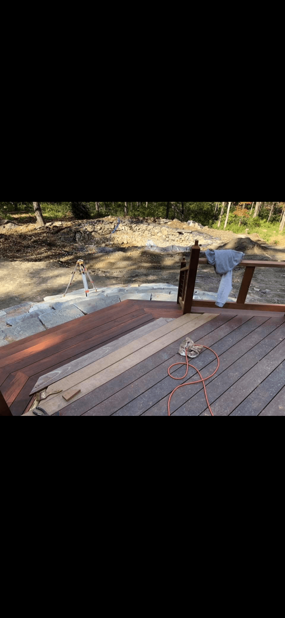 Composite deck installation with dark wood decking