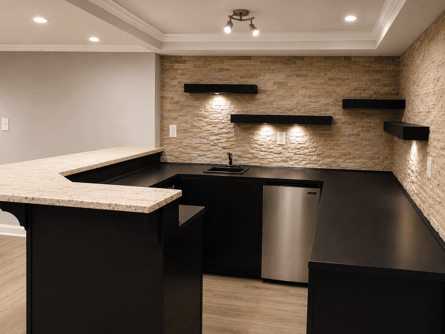 Finished basement bar with stone accent wall and floating shelves